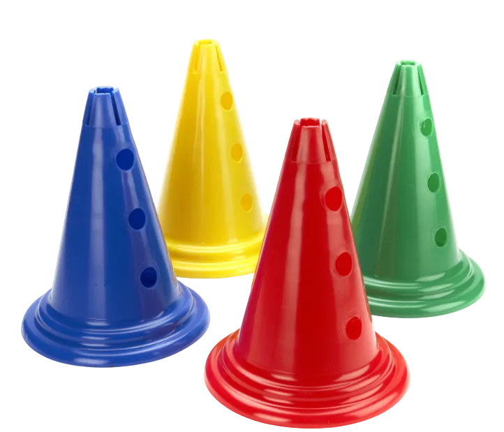 Four plastic training cones in blue, yellow, red, and green, arranged on a plain white background.